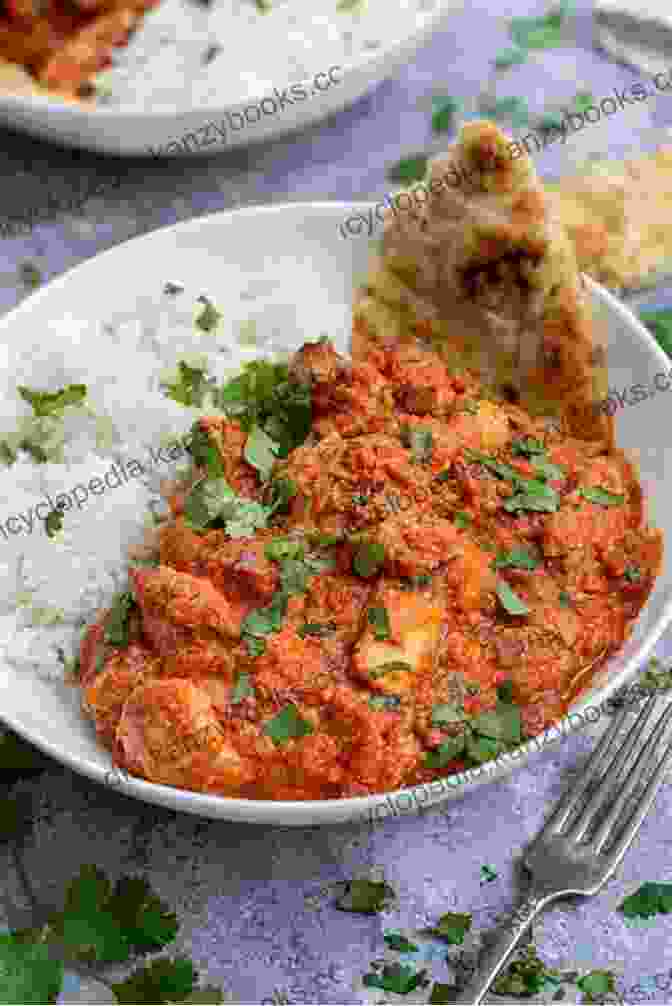 Creamy Chicken Tikka Masala Served In A Bowl, Garnished With Cilantro And Lime Wedges. The Complete Instant Pot Cookbook: Recipes For Easy Meals: Chicken Breast Instant Pot Recipes